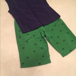 Green shorts with navy blue tennis racquets